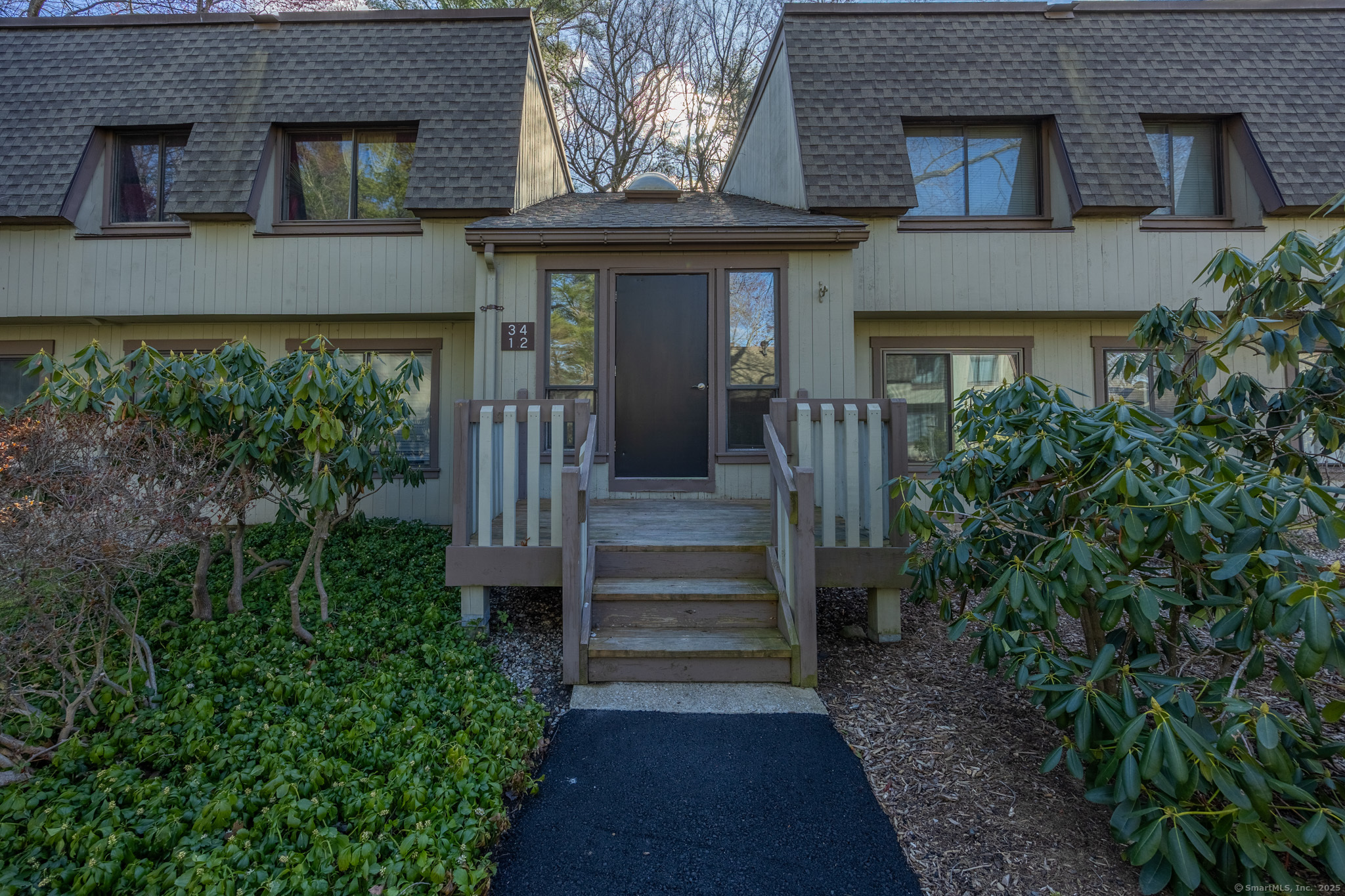 2 Byron Drive, Unit 2 Avon, CT 06001 - Photo 1 of 1 front view of a house with a small yard