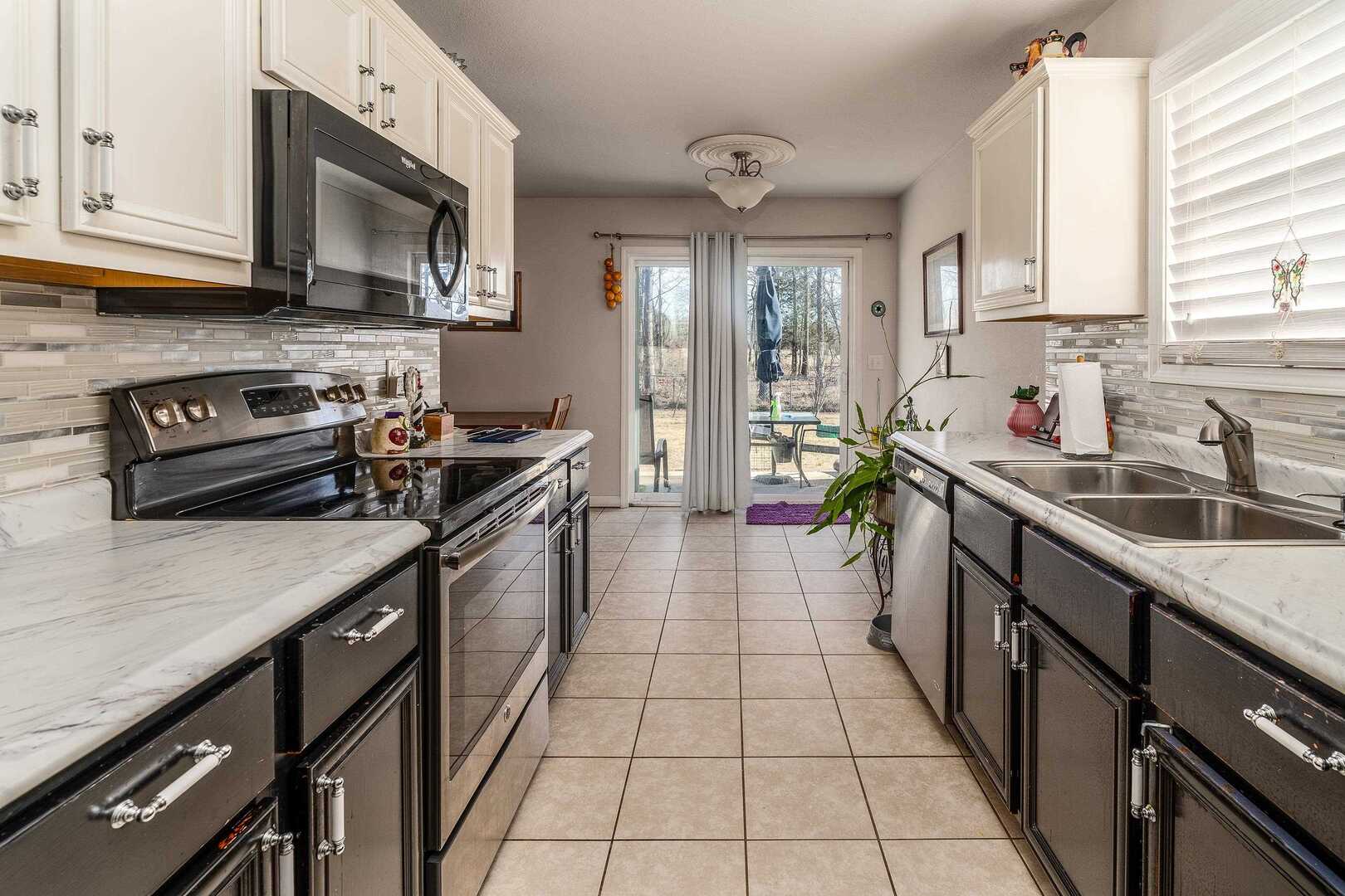 11114 Zachary Drive Marion, IL 62959 - Photo 12 of 34 a kitchen that has a sink and a stove