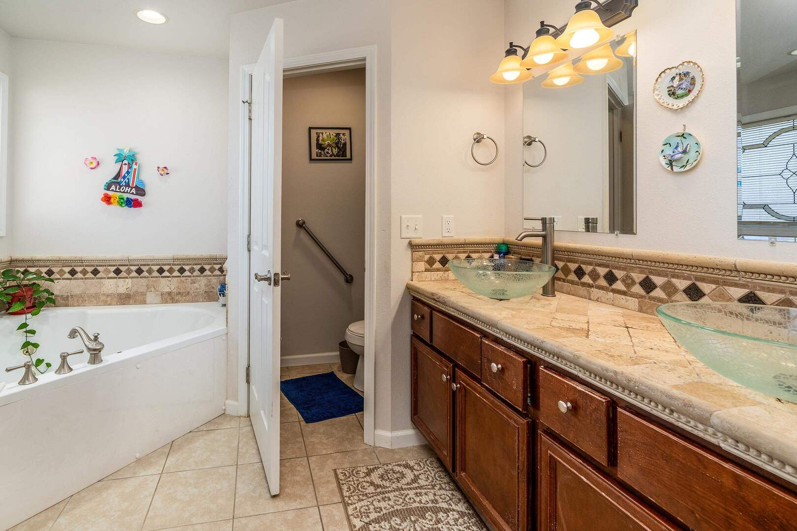 11114 Zachary Drive Marion, IL 62959 - Photo 15 of 34 a spacious bathroom with a granite countertop sink a mirror a bathtub and toilet