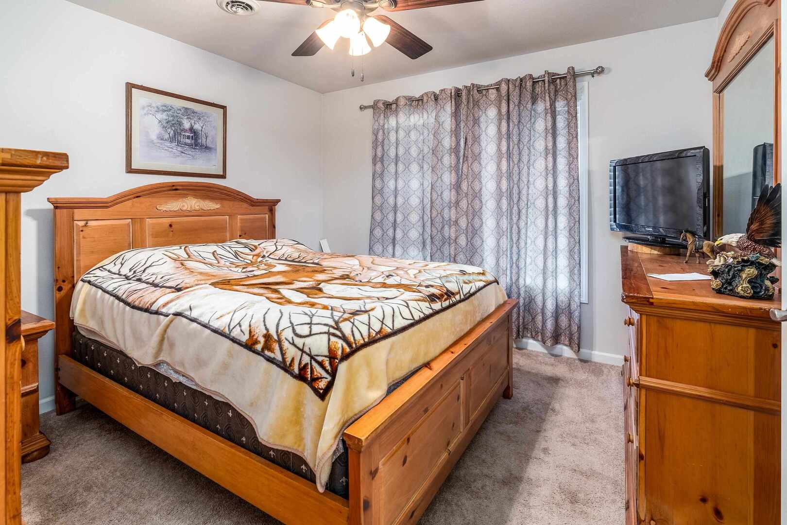 11114 Zachary Drive Marion, IL 62959 - Photo 19 of 34 a bedroom with a bed and a flat screen tv
