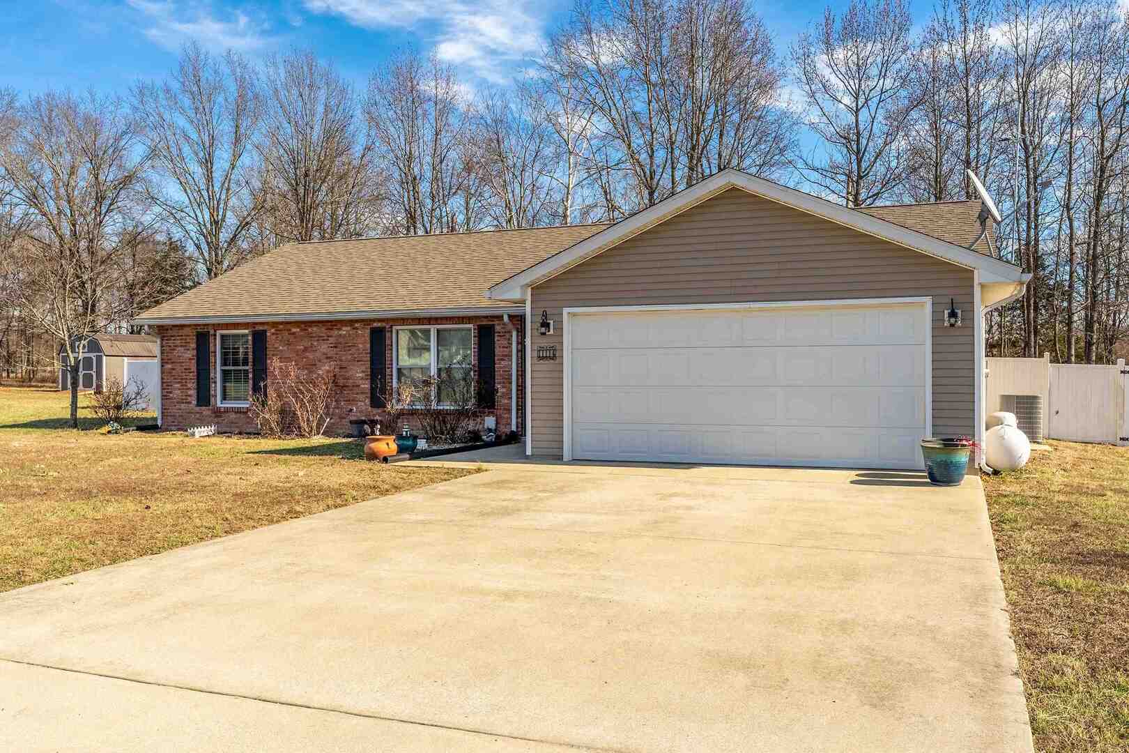 11114 Zachary Drive Marion, IL 62959 - Photo 3 of 34 a front view of a house with a yard and garage