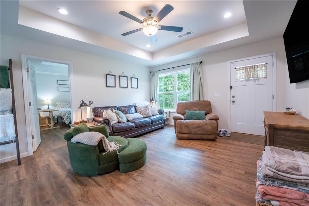 118 Wash Rider Road Dahlonega, GA 30533 - Photo 5 of 37 a living room with furniture and a flat screen tv