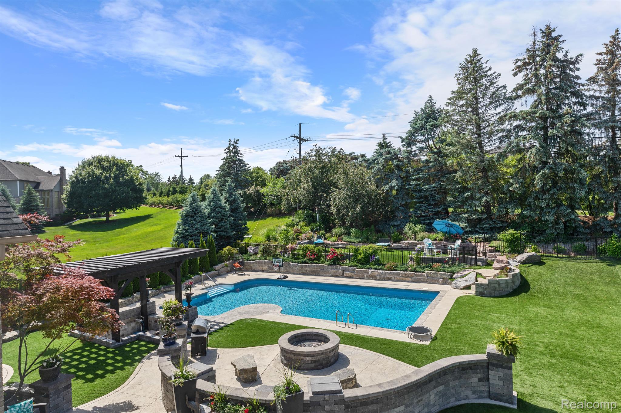 1424 Pebble Ridge Drive Rochester, MI 48307 - Photo 61 of 72 63 Backyard pool