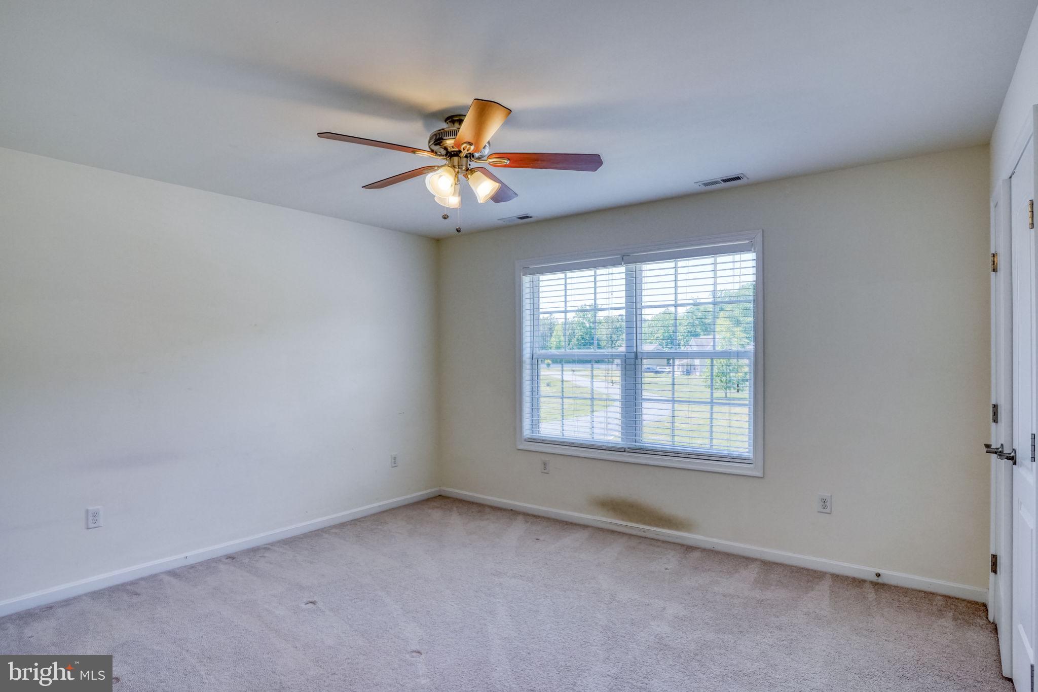107 Hunters Run Magnolia, DE 19962 - Photo 28 of 41 an empty room with a window and a fan