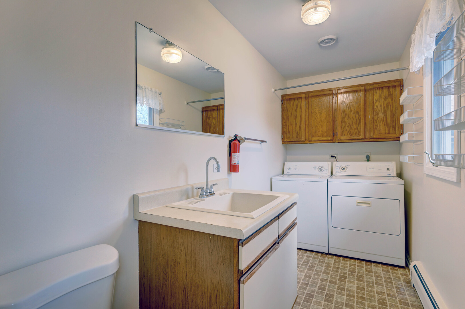 547 Eichler Drive West Dundee, IL 60118 - Photo 12 of 24 a bathroom with a sink a toilet and mirror