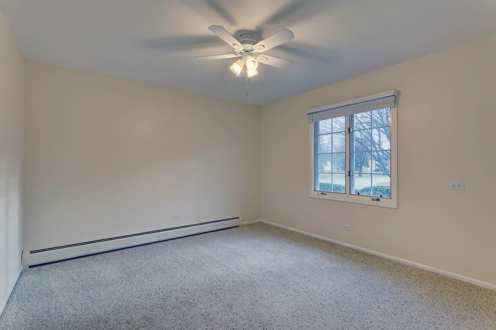 547 Eichler Drive West Dundee, IL 60118 - Photo 14 of 24 an empty room with a window and a ceiling fan