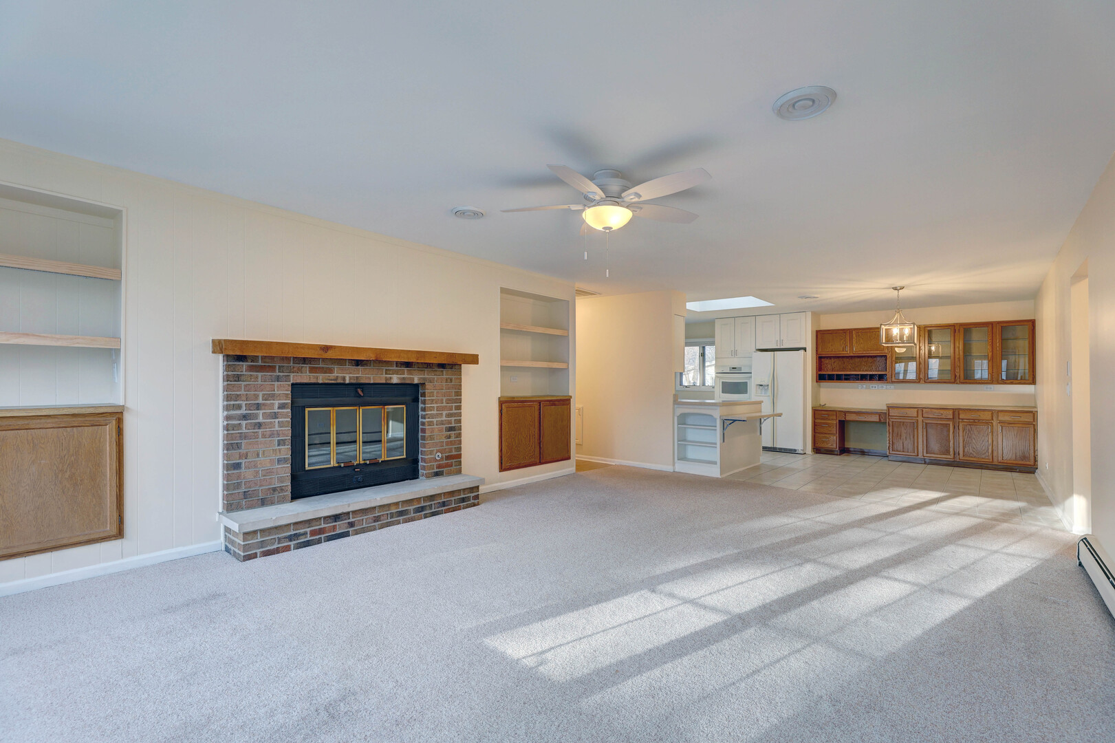 547 Eichler Drive West Dundee, IL 60118 - Photo 4 of 24 a view of an empty room with a fireplace and a window