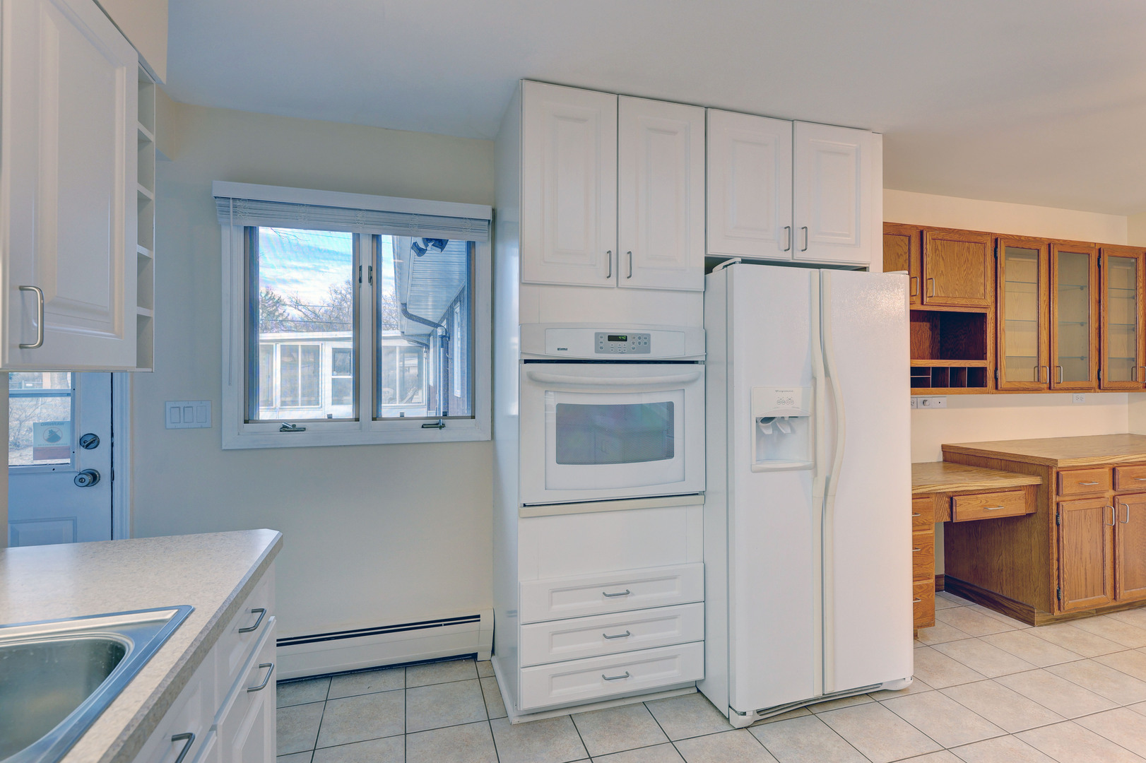 547 Eichler Drive West Dundee, IL 60118 - Photo 7 of 24 a kitchen with white cabinets and white appliances