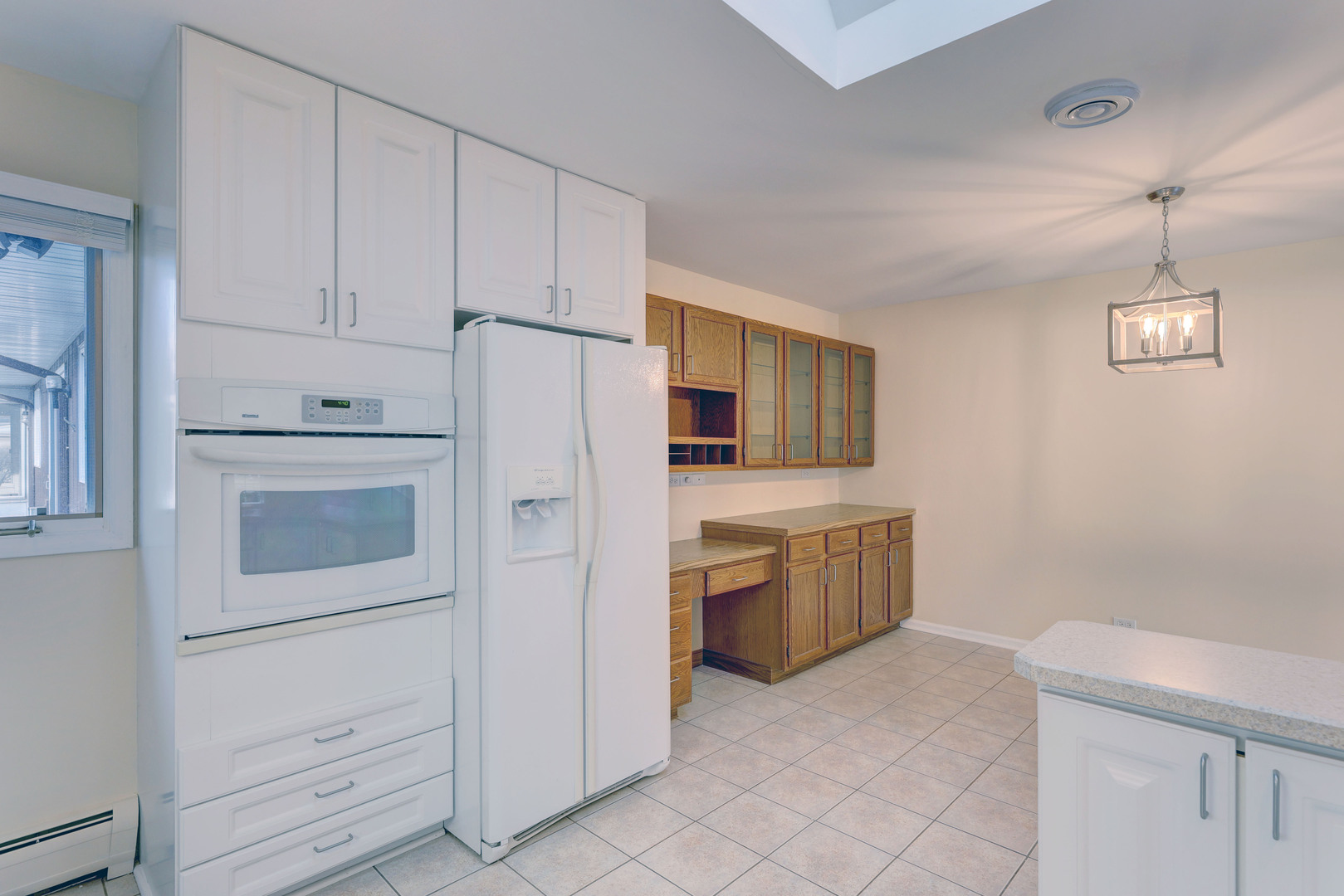 547 Eichler Drive West Dundee, IL 60118 - Photo 8 of 24 a kitchen with cabinets stainless steel appliances and sink