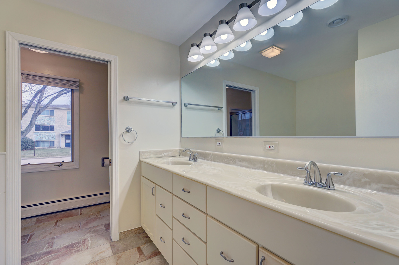 547 Eichler Drive West Dundee, IL 60118 - Photo 10 of 24 a bathroom with a granite countertop sink a light fixture and a mirror