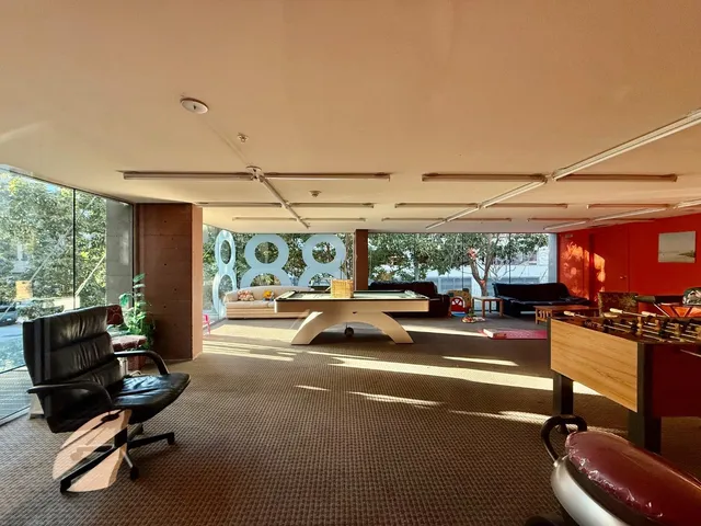 a view of a patio with table and chairs