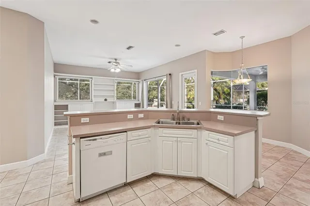 a stove top oven sitting inside of a kitchen