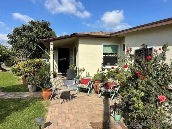 front view of a house with a small yard