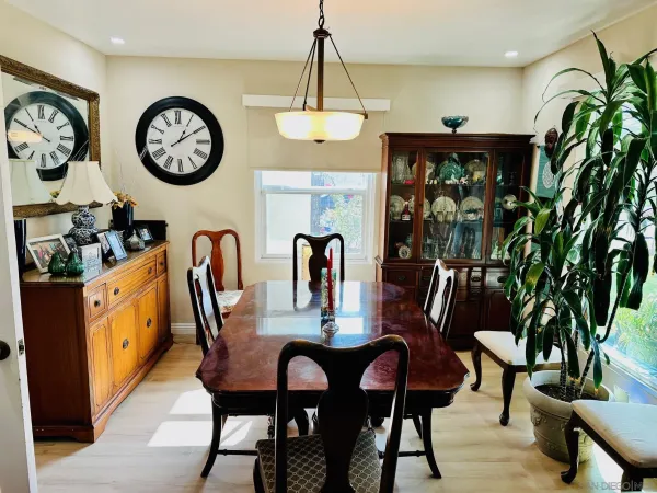 a view of a dining area with furniture and a chandelier