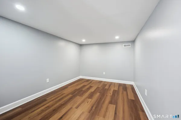a view of room with wooden floor