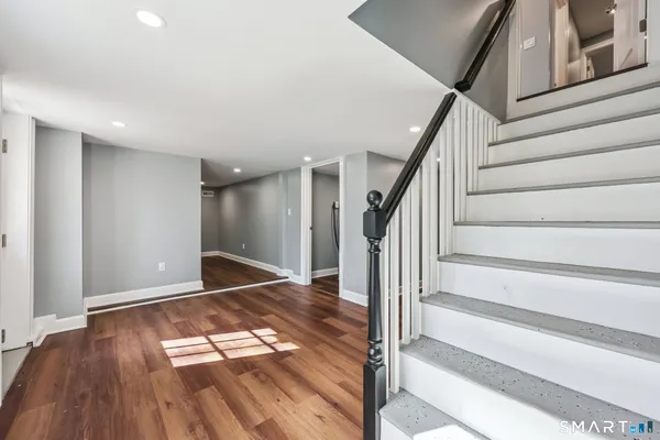 a view of entryway with wooden floor