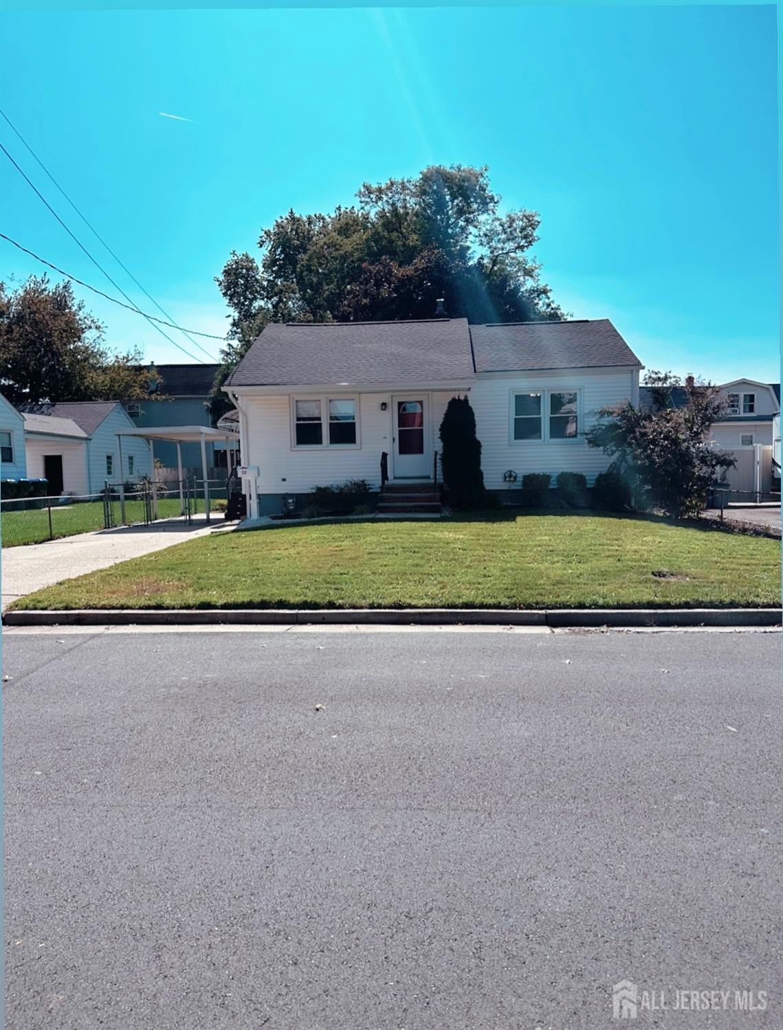 32 Apple Street Edison, NJ 08817 - Photo 2 of 11 front view of house with a yard and a large trees