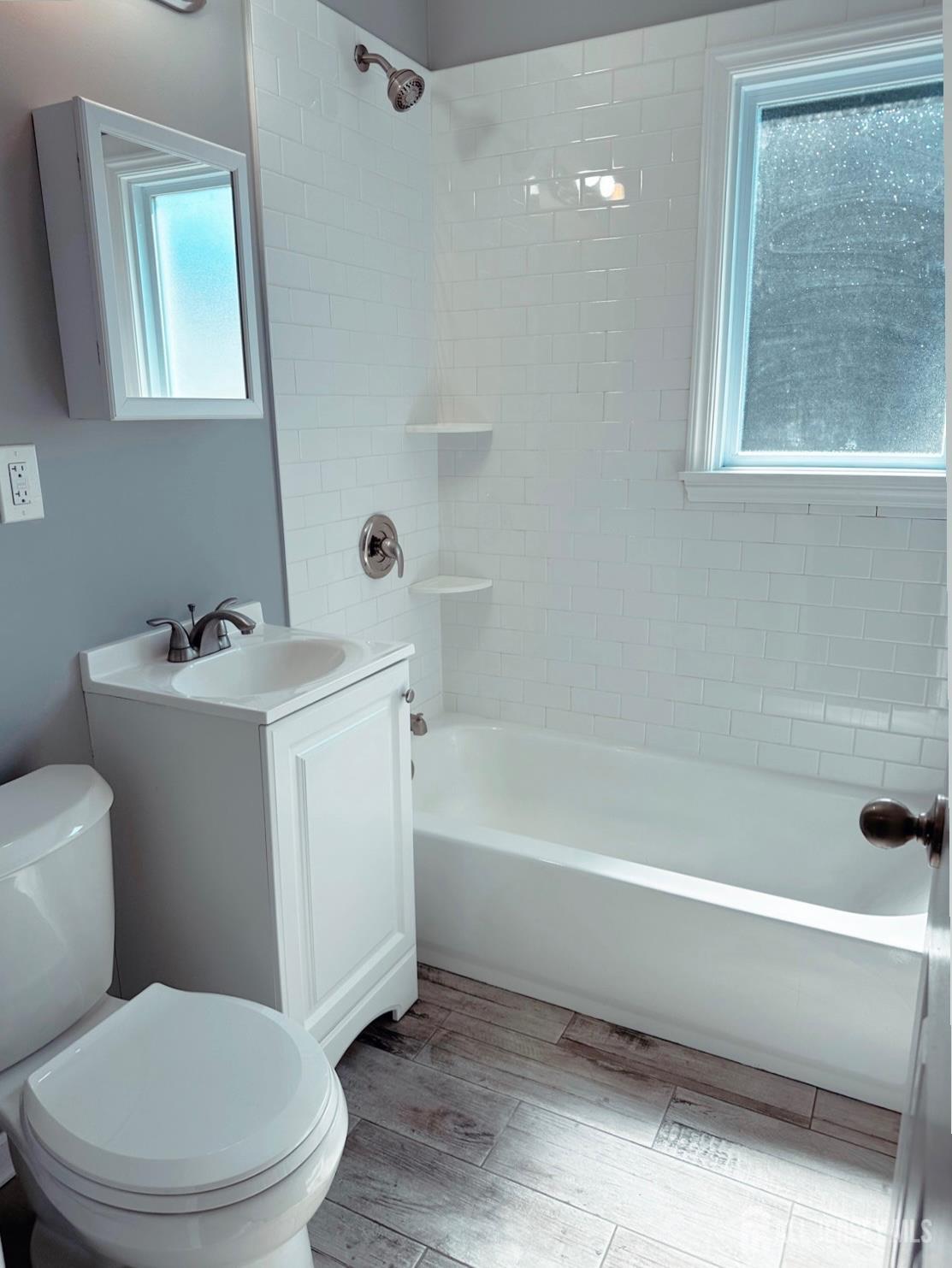 32 Apple Street Edison, NJ 08817 - Photo 7 of 11 a bathroom with a sink toilet and bathtub
