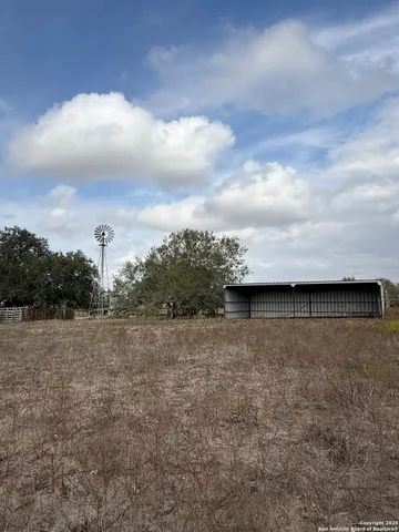 an aerial view of ocean and trees
