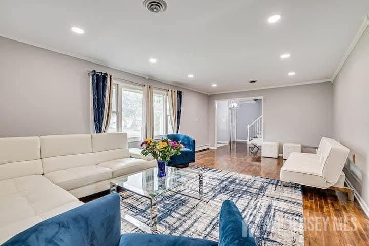 a living room with furniture and a large window