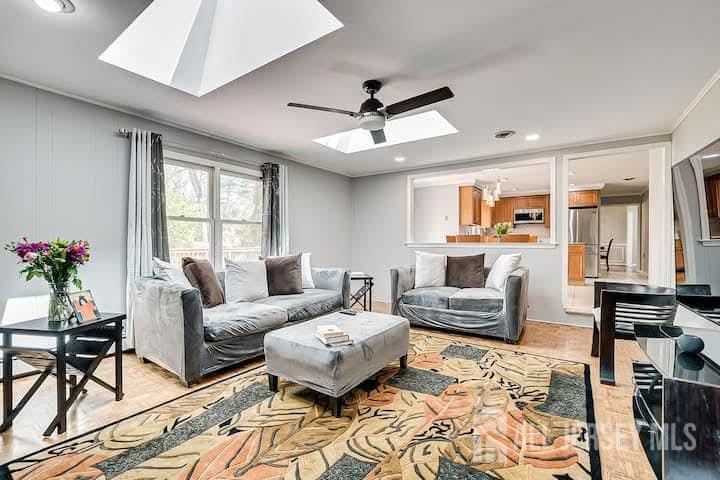 3993 Park Avenue Edison, NJ 08820 - Photo 13 of 37 a living room with furniture and a flat screen tv