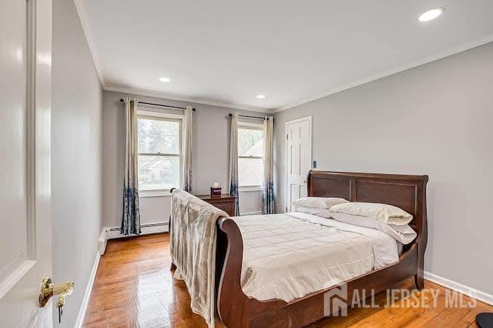 3993 Park Avenue Edison, NJ 08820 - Photo 19 of 37 a bed room with a bed and a chair
