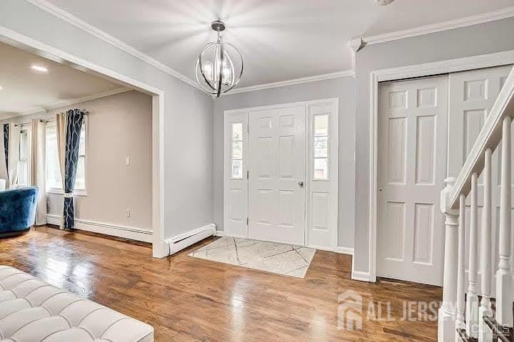 3993 Park Avenue Edison, NJ 08820 - Photo 5 of 37 a view of a chandelier in a room with stairs and a chandelier