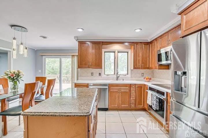3993 Park Avenue Edison, NJ 08820 - Photo 10 of 37 a kitchen with a sink stove and cabinets