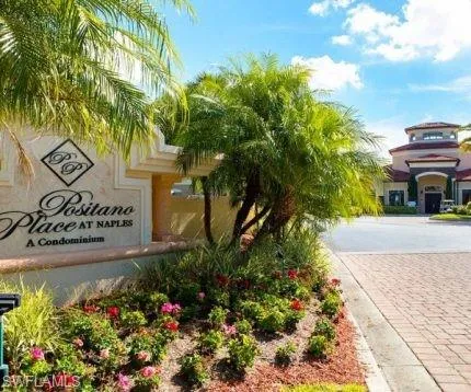 a view of a house with pool and sitting area