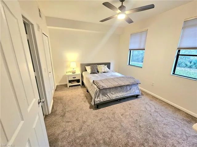 a bedroom with a bed and a walk in closet