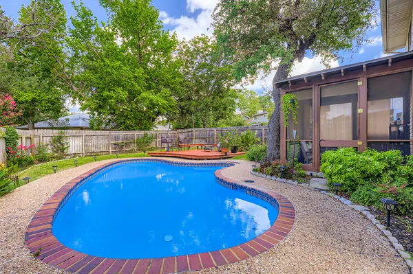 a view of a swimming pool with a patio