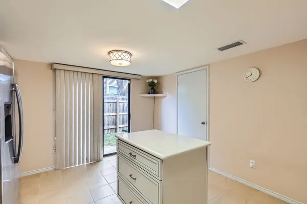 a large bathroom with a large tub and sink