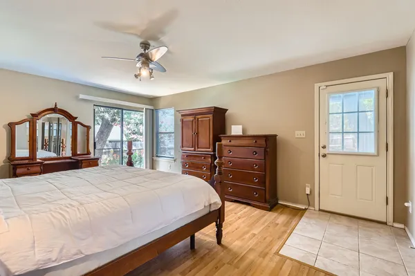 a view of a kitchen with a refrigerator and a ceiling fan