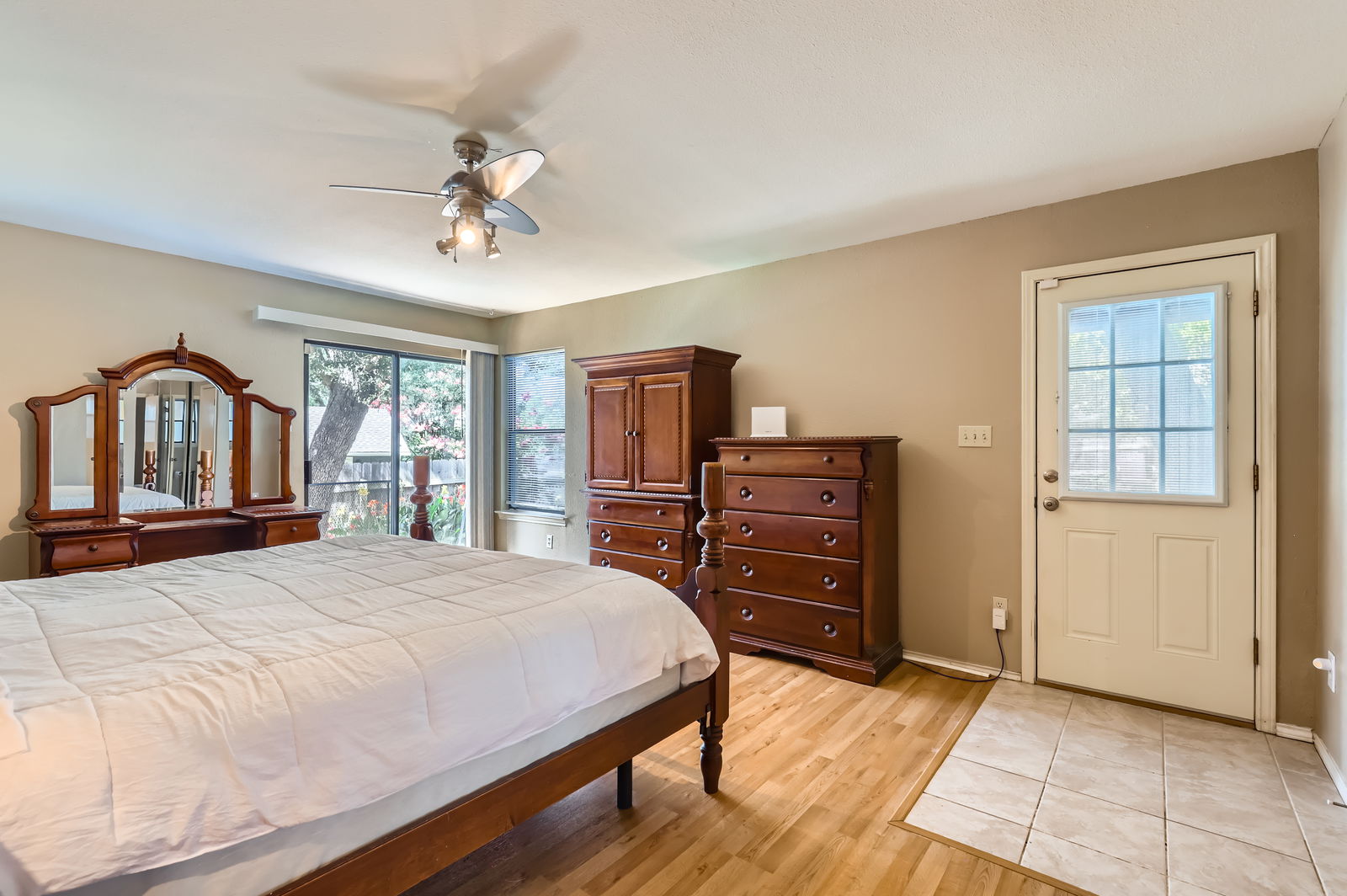 4513 Sidereal Drive Austin, TX 78727 - Photo 19 of 38 a bedroom with a bed and wooden floor