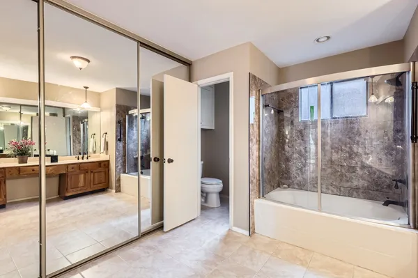a bathroom with a double vanity sink mirror and double
