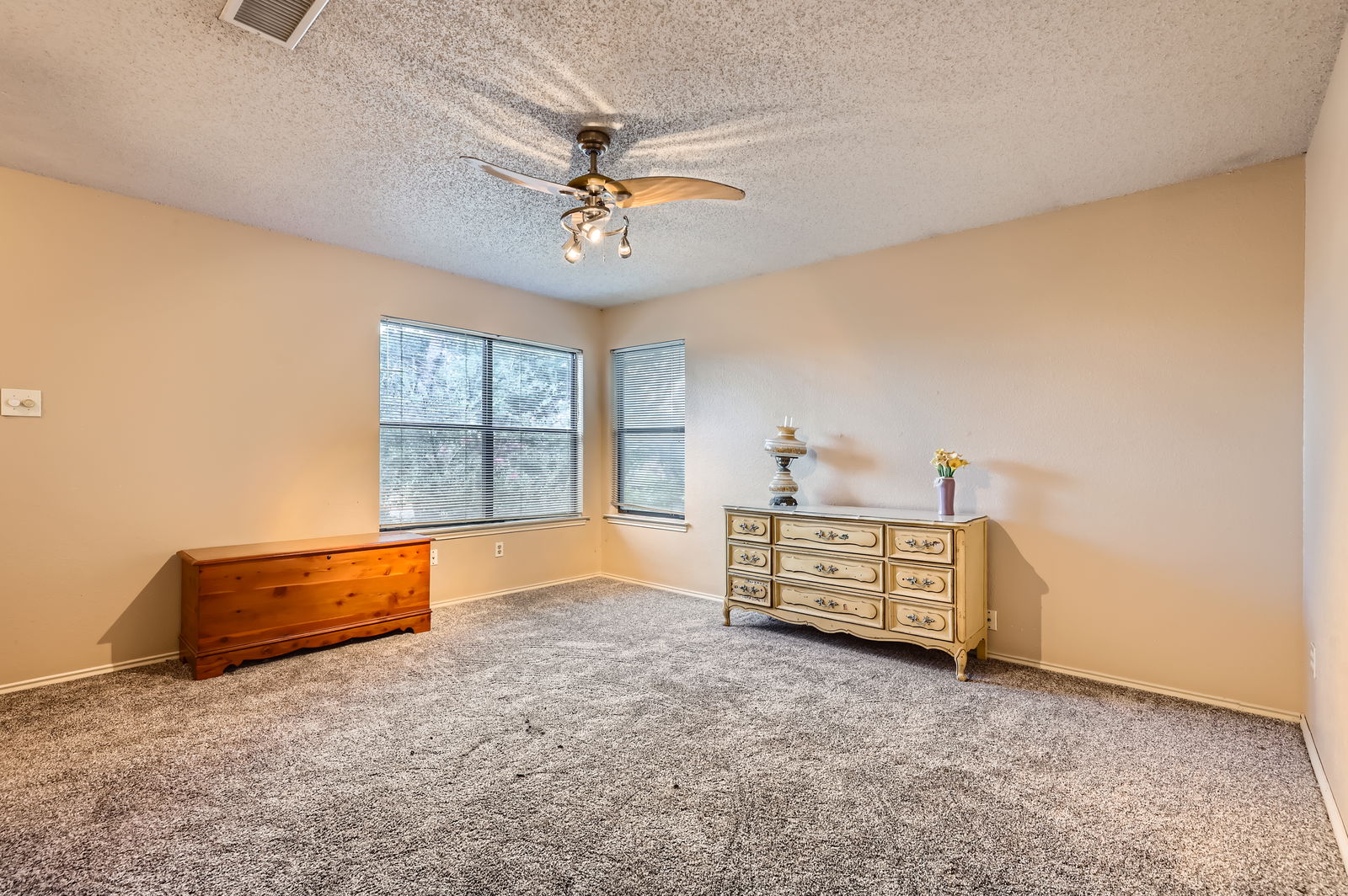4513 Sidereal Drive Austin, TX 78727 - Photo 24 of 38 Bonus room overlooks the living area with carpet flooring, a ceiling fan.