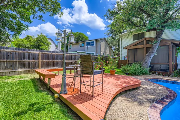 a view of a backyard with sitting area