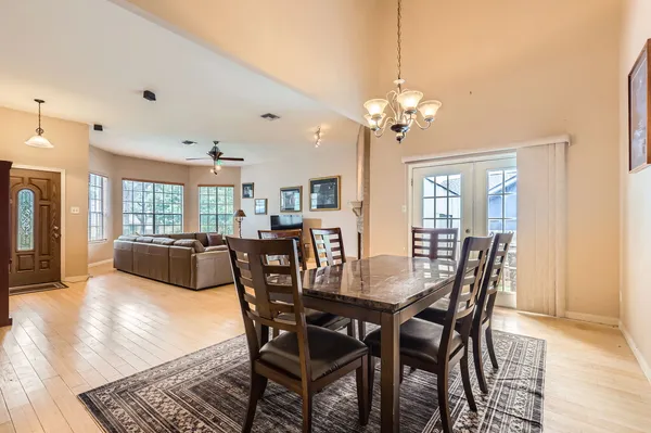 a view of a dining room with furniture window and wooden floor