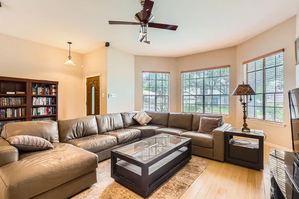 a living room with furniture and a fireplace