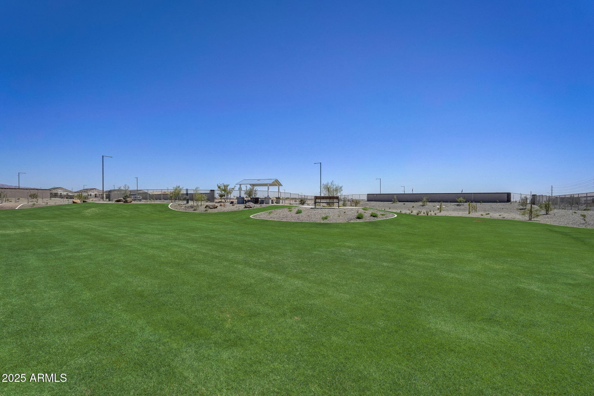 24233 West Chanute Pass Buckeye, AZ 85326 - Photo 3 of 14 a view of a field with an outdoor space
