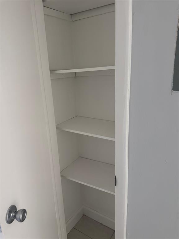 3050 Northeast 5th Terrace, Unit 6 Wilton Manors, FL 33334 - Photo 14 of 22 a view of an empty walk in closet
