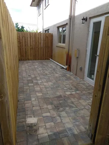 a view of backyard with tub