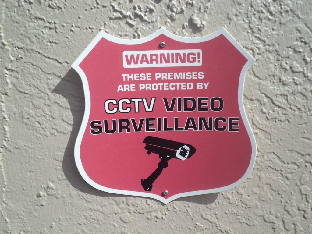 3050 Northeast 5th Terrace, Unit 6 Wilton Manors, FL 33334 - Photo 22 of 22 a sign that is on a brick wall