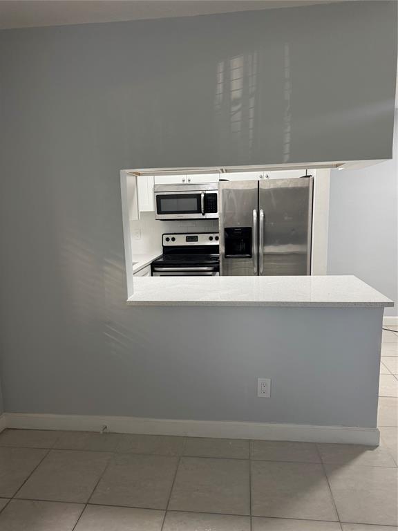 3050 Northeast 5th Terrace, Unit 6 Wilton Manors, FL 33334 - Photo 6 of 22 a close view of cabinet