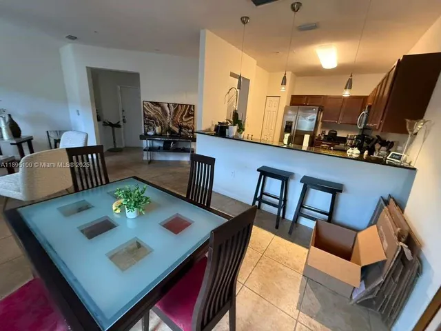 a view of a dining room with furniture and a wooden floor