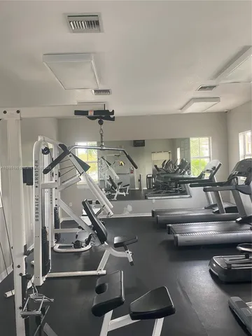 a gym room with gym equipment