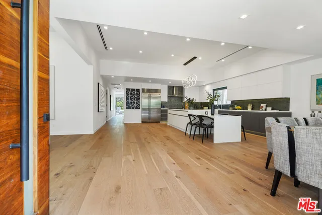 a view of kitchen with furniture and wooden floor