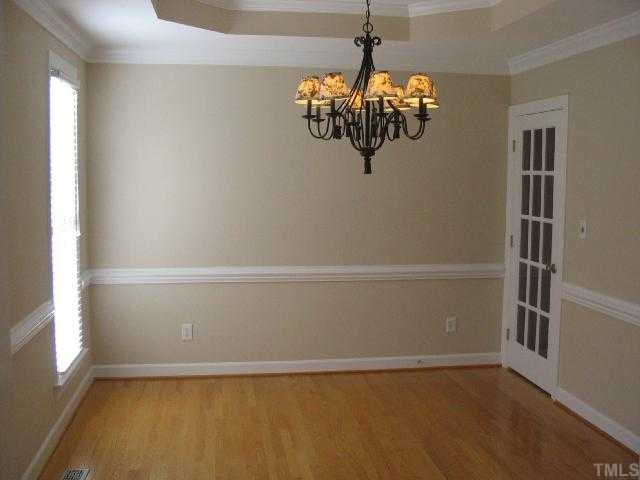 104 Lyncroft Lane Cary, NC 27519 - Photo 2 of 12 Features Hardwood Floors, Crown Molding, Trey Ceiling, Two Inch Bllinds, And Chair Molding!
