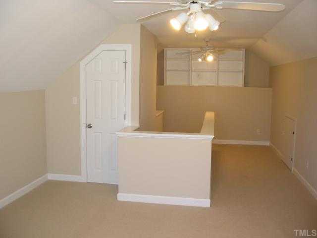 104 Lyncroft Lane Cary, NC 27519 - Photo 12 of 12 Bonus room or fourth bedroom, new carpet, paint, ceiling fan, Has closet and storage area!