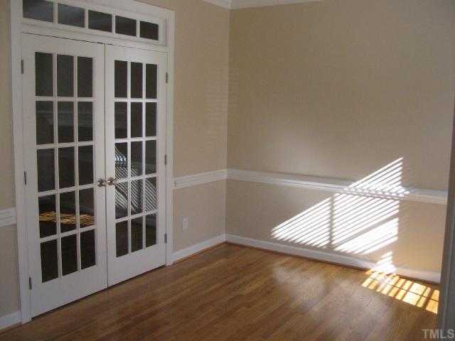 104 Lyncroft Lane Cary, NC 27519 - Photo 5 of 12 Living room with French doors, Chair Molding and Hardwoods!